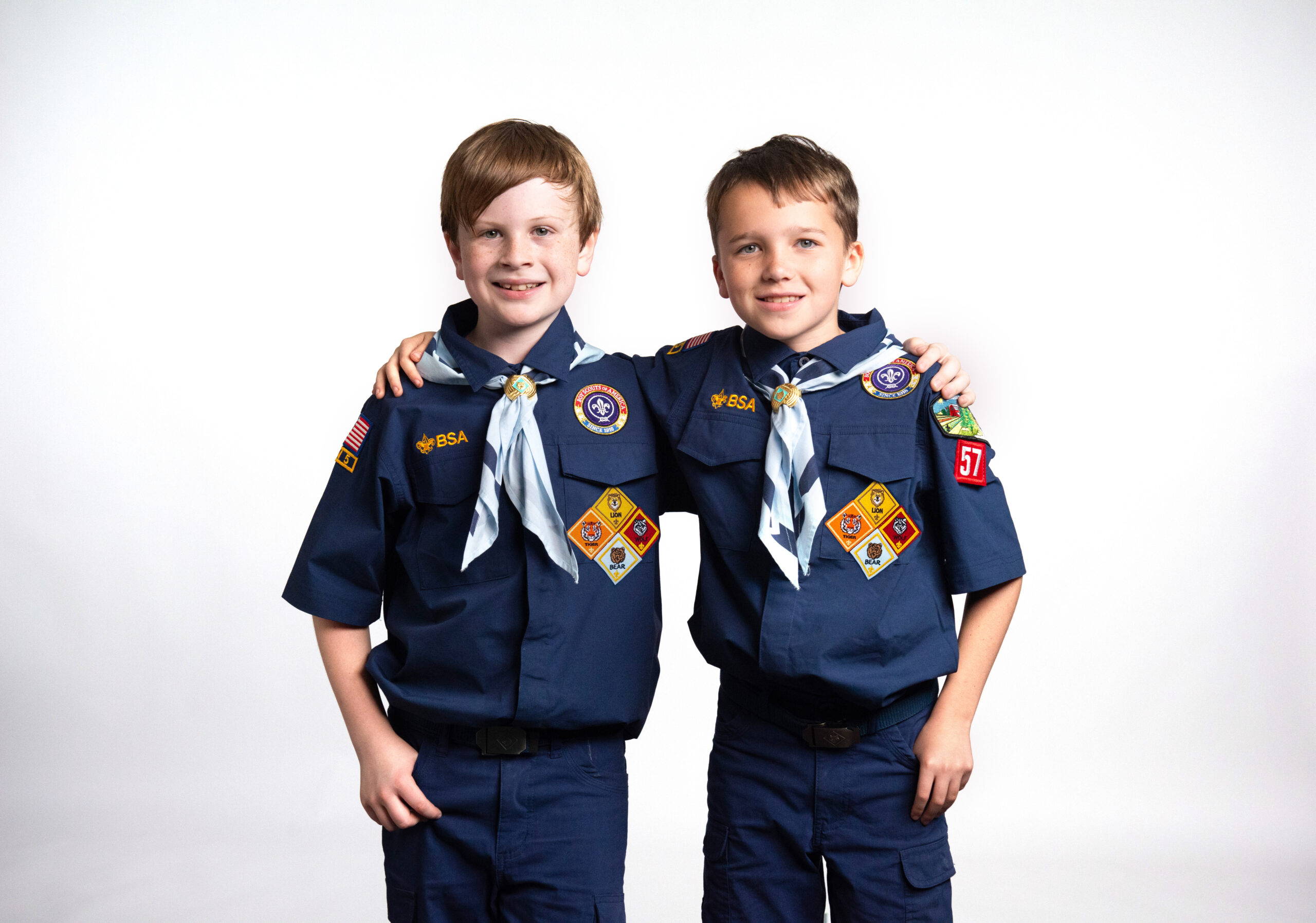 Boys with arms around each other - Cub Scouts Handbook 2024 Bear